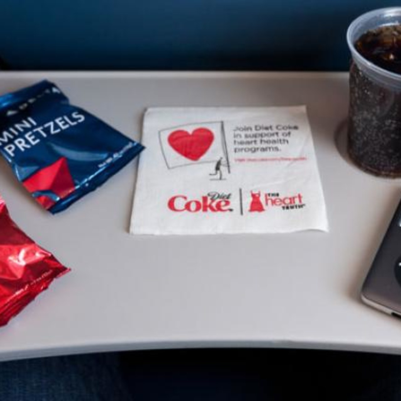 Tray table with Delta Air Lines snacks